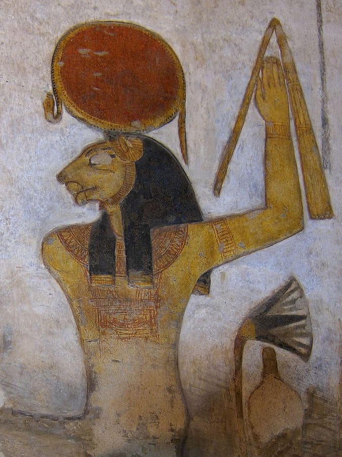 alt="Goddess Sekhmet with a sun disc on her head"